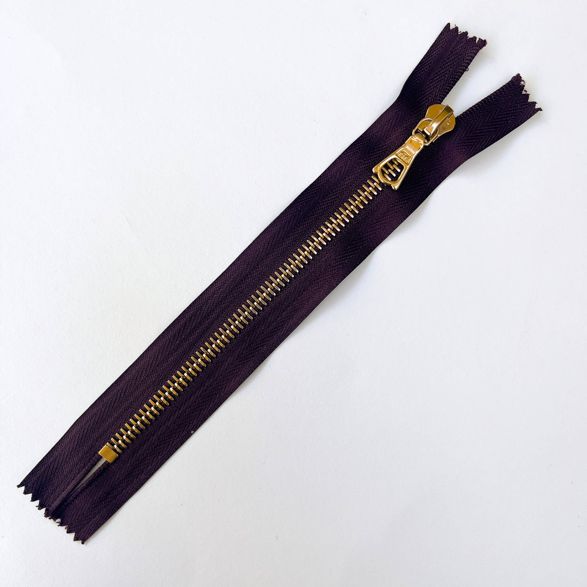 Dark Plum, dark purple  RiRi #6 Metal Zip - 17cm  by RiRi with gold metal teeth and decorative puller - Kleins Haberdashery