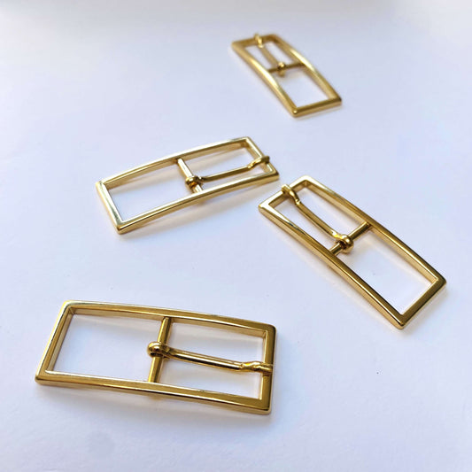 gold rectangular buckles with prongs