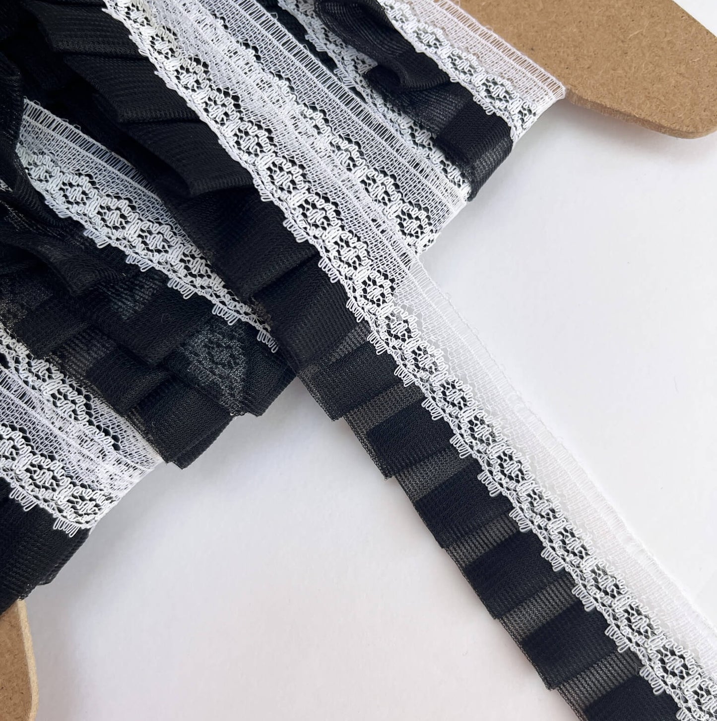 Black lace trim on a white background