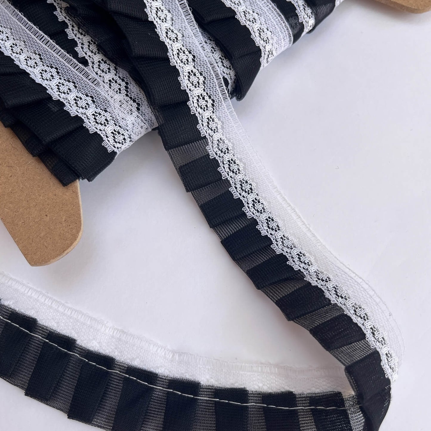  black and white lace detailing on a white background