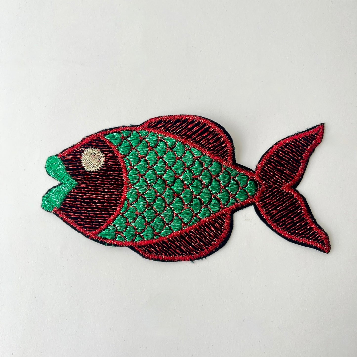 Large embroidered fish patch with metallic thread with green body and red tail
