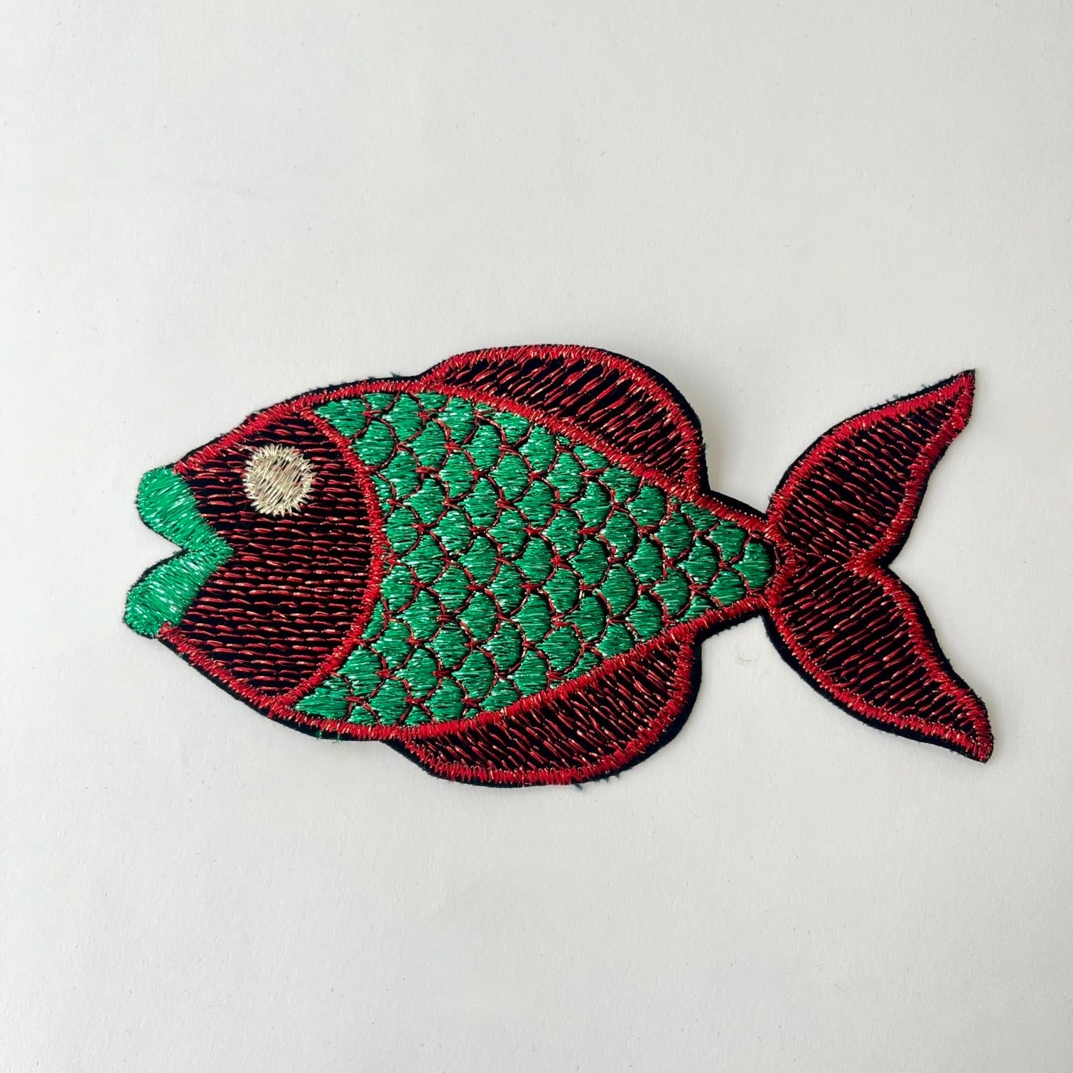 Large embroidered fish patch with metallic thread with green body and red tail