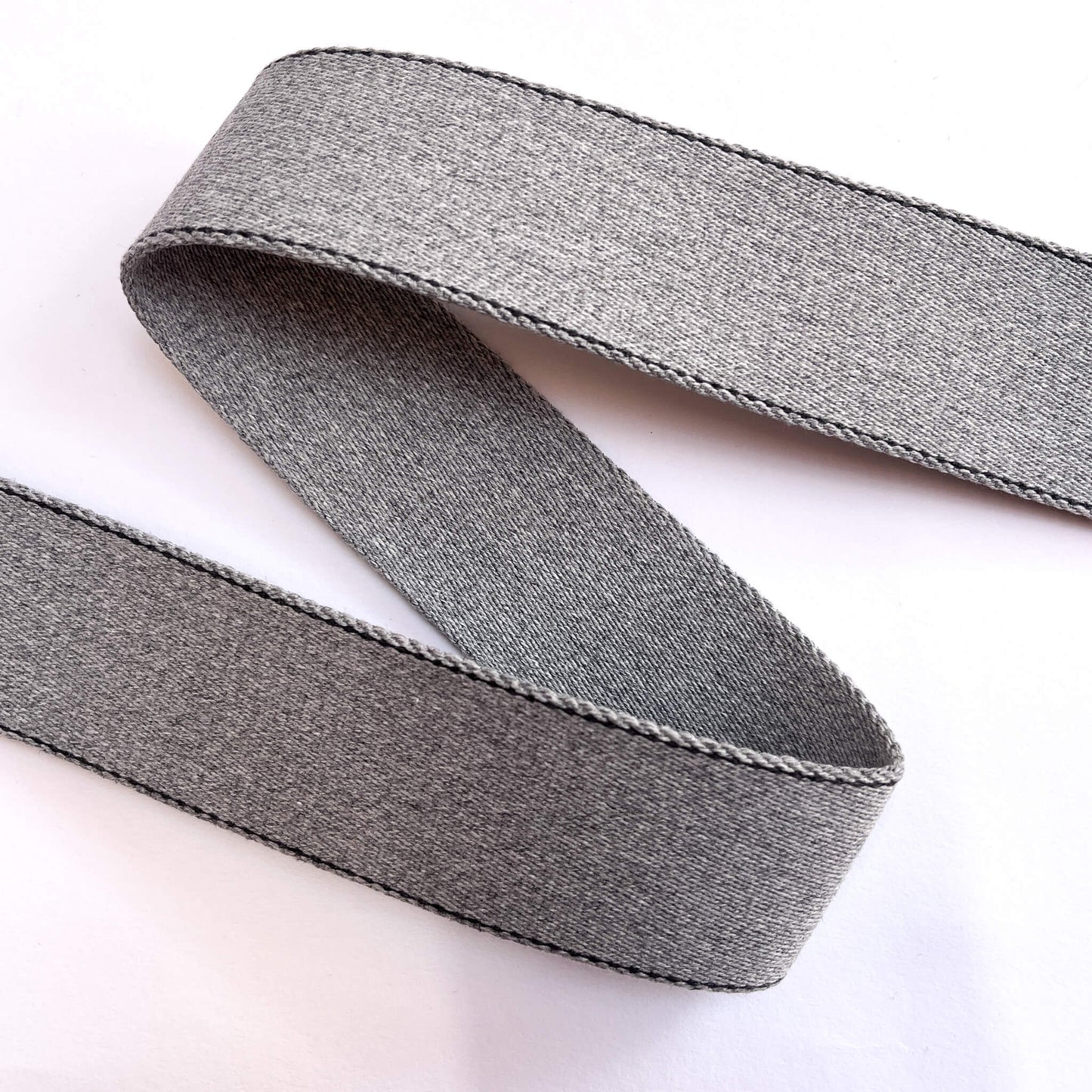 Close-up of 40mm recycled cotton webbing showing stitched construction