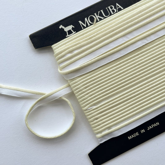 Mokuba cream piping cord
 on a white background
