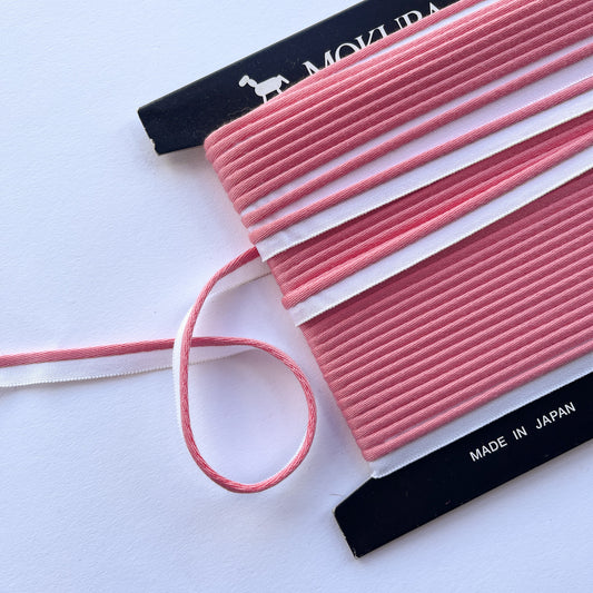 Mokuba pink piping cord
 on a white background
