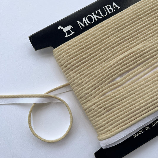 Mokuba Piping Cord in Vanilla on a white background, Kleins Haberdashery