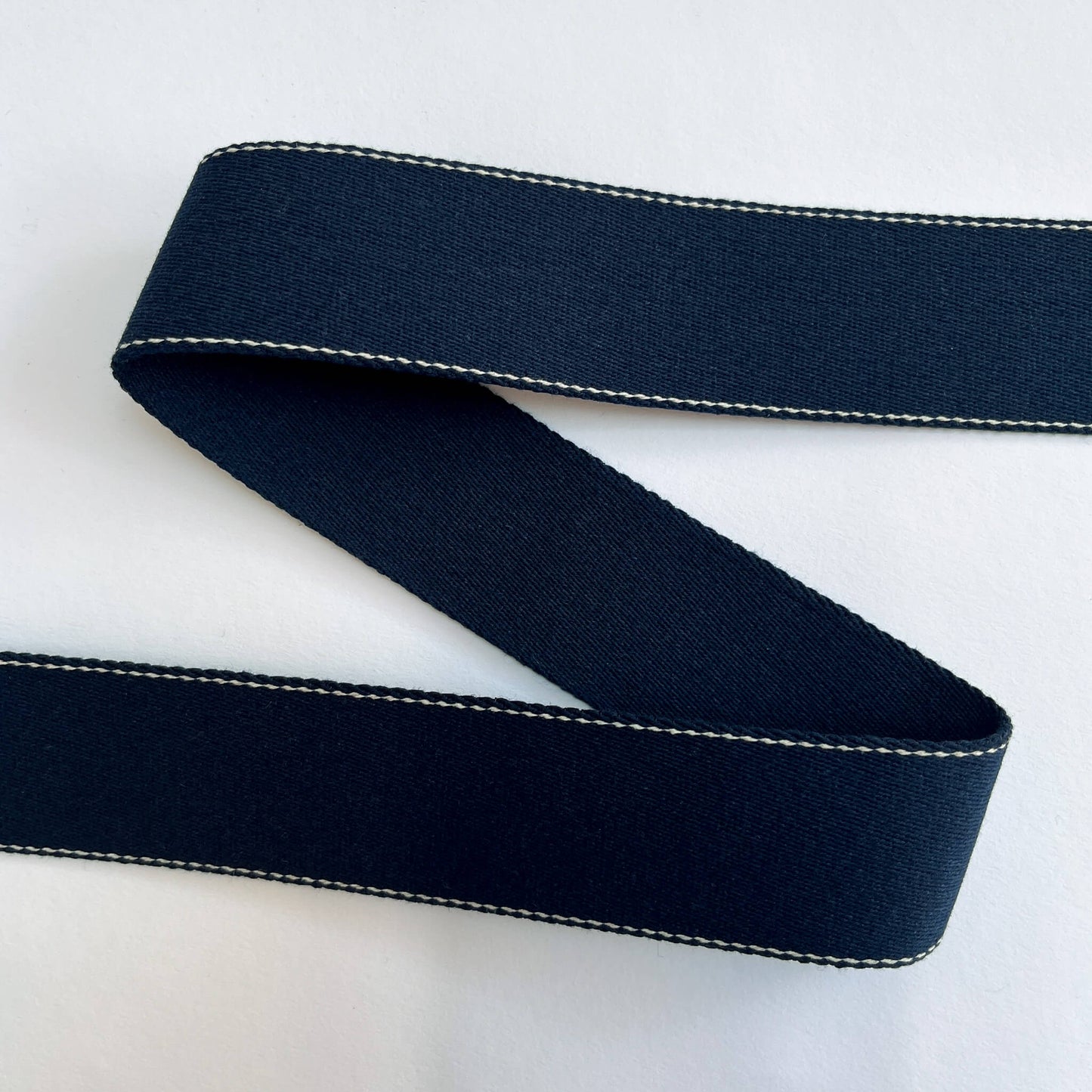 40mm recycled cotton webbing showing plain and stitched sides