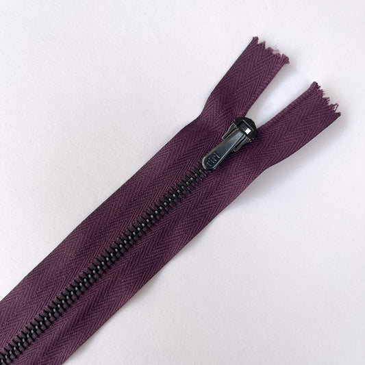 close up of a purple  RiRi #6 Metal Zip - 20cm in length by RiRi with matt gunmetal  teeth and locking teardrop puller - Kleins Haberdashery