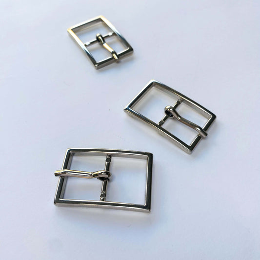 Silver Rectangle Prong Buckle - 40mm Three metal square buckles on a light grey background