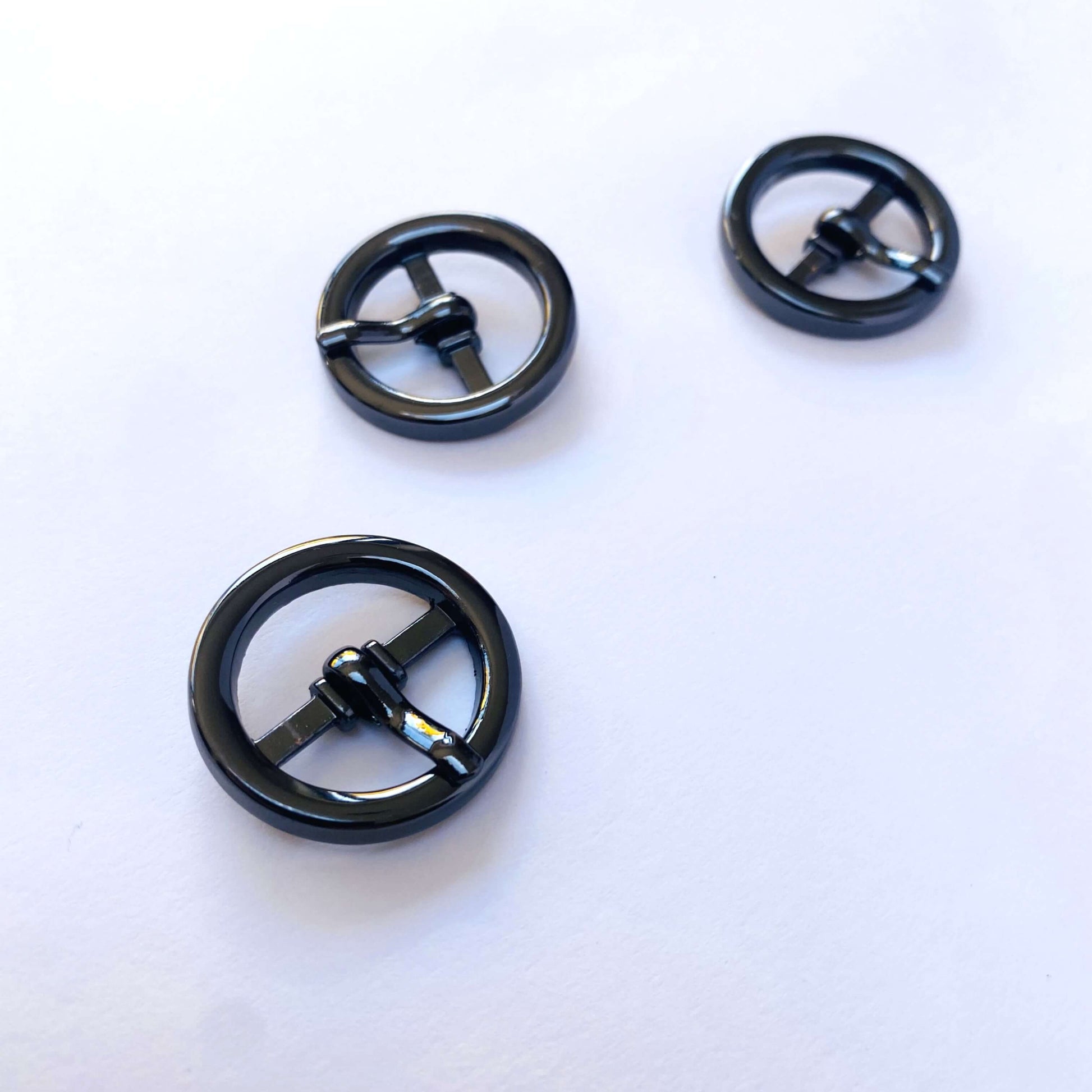 3 Small round prong buckle with black chrome -gunmetal finish on white background