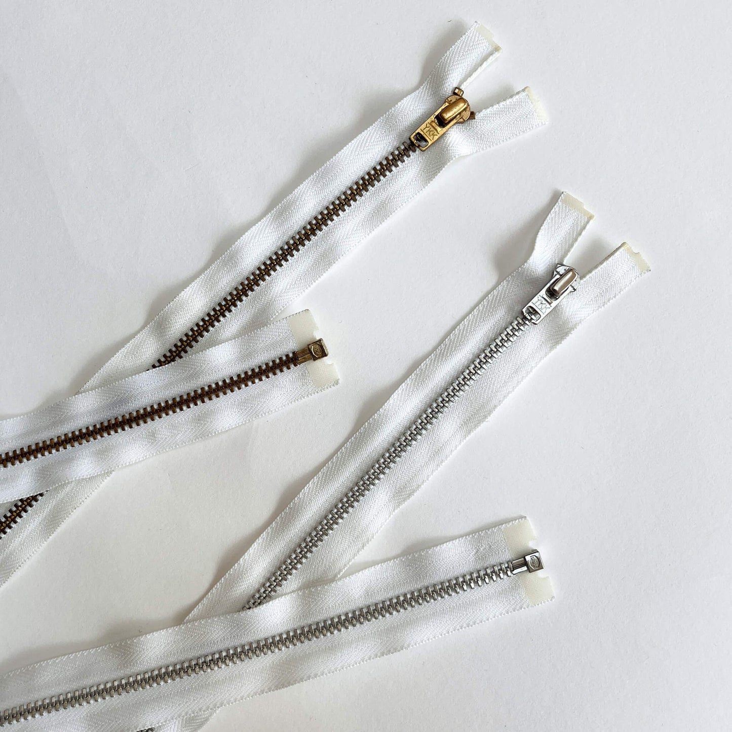White YKK #4.5 Open End brass teeth Zip, 100cm length  YKK  jeans zip with gold and brass metal teeth and auto-lock puller -  Kleins Haberdashery