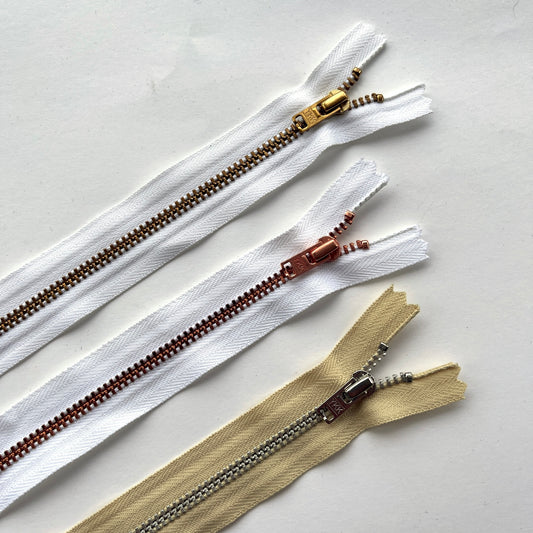 YKK  jeans zip with metal teeth and auto-lock puller in various neutral and white shades - Kleins Haberdashery