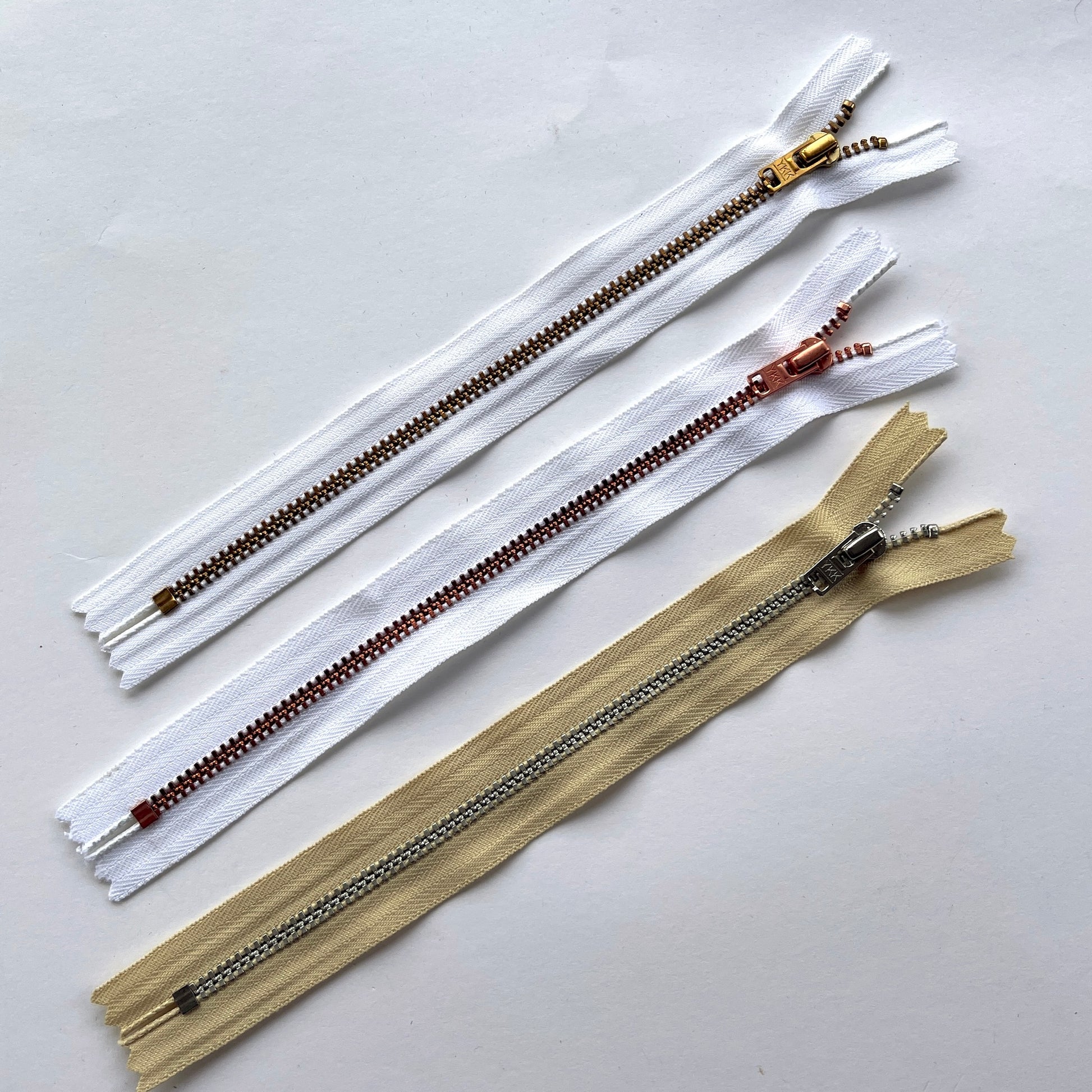 YKK  jeans zip with metal teeth and auto-lock puller in various neutral and white shades - Kleins Haberdashery