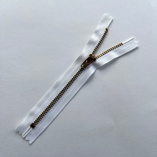 YKK white jeans zip with brass metal teeth and auto-lock puller