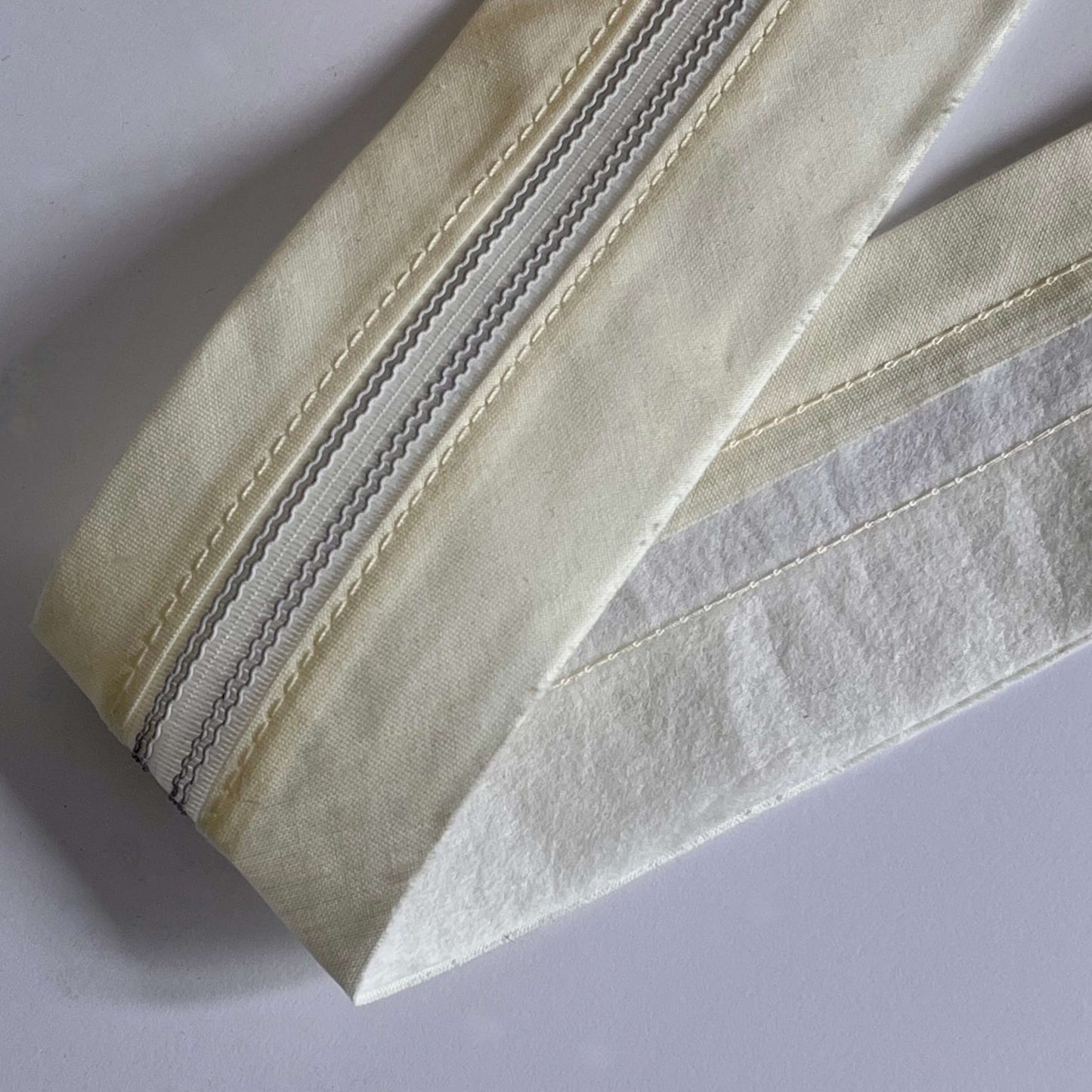 rubberised waistband lining in cream  for mens trousers, tailoring supply