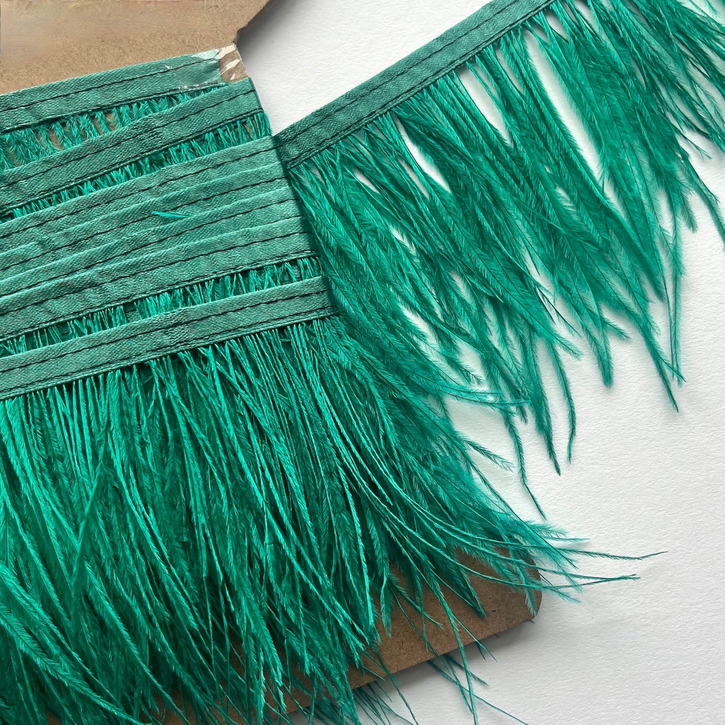 10cm deep Real ostrich feather fringe trim on a Satin ribbon for easy attachment. Would look incredible added to a jacket as a statement cuff!  Ideal for dressmaking, crafts, millinery, costumes, hat making, fascinators, bridal accessories, headpieces, bags.