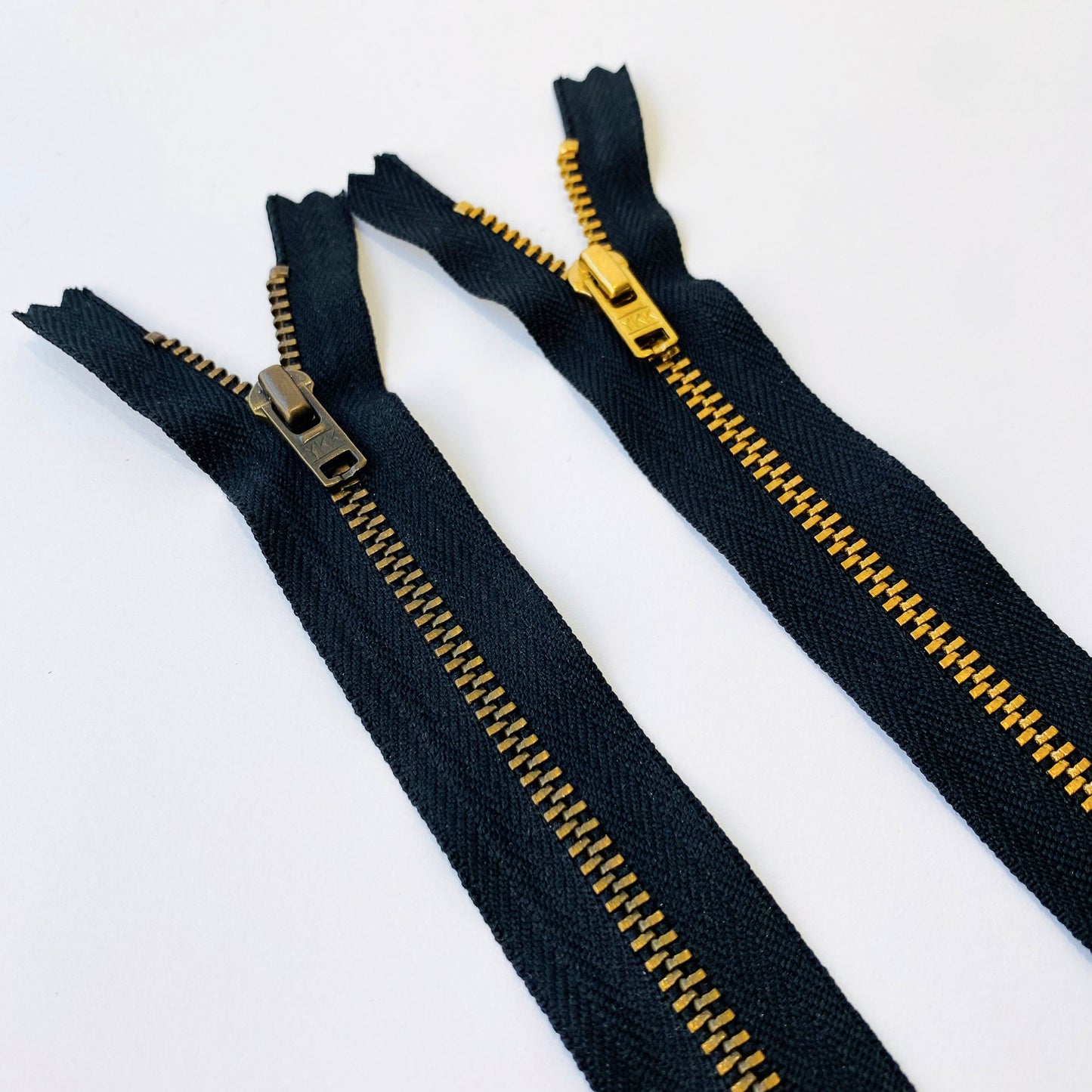 70 cm long #4.5 Jeans Weight Closed End Zip by YKK - black tape with either antique brass or bright brass coloured teeth - Kleins Haberdashery
