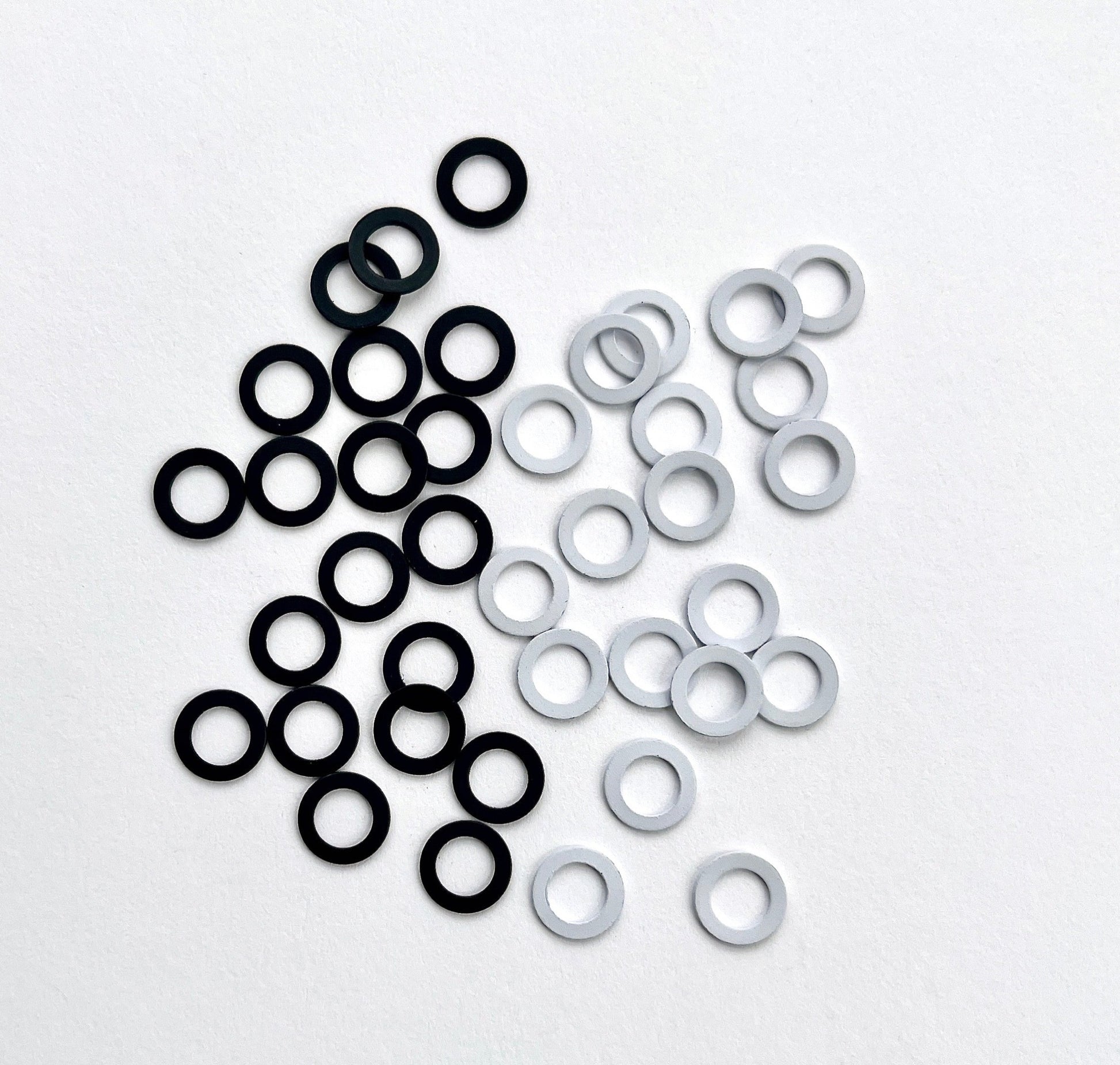 Small metal ring with 6mm internal diameter, Flat Metal Ring. For use within bra making and swimwear. Can be used to make adjustable straps too! White ring or black ring
