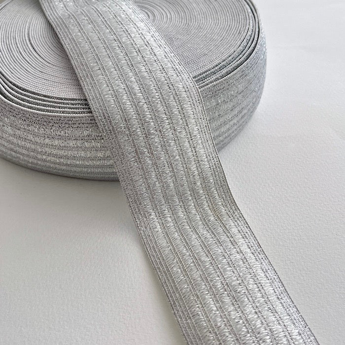 Live out your best disco dreams with these glorious lurex elastics! This stitched metallic elastic is perfect for adding a bit of sparkle and stretch to a waistband, cuff or elasticated belt. Can be worn directly against the skin as it is soft and non-scratchy on the reverse side.