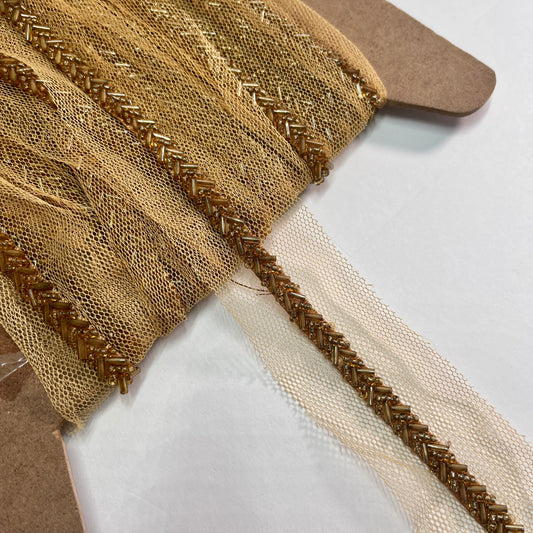 Beautiful bugle bead trim, hand beaded on a tulle netting. Popular for bridal wear, evening wear, crafts, jewellery and headband making.