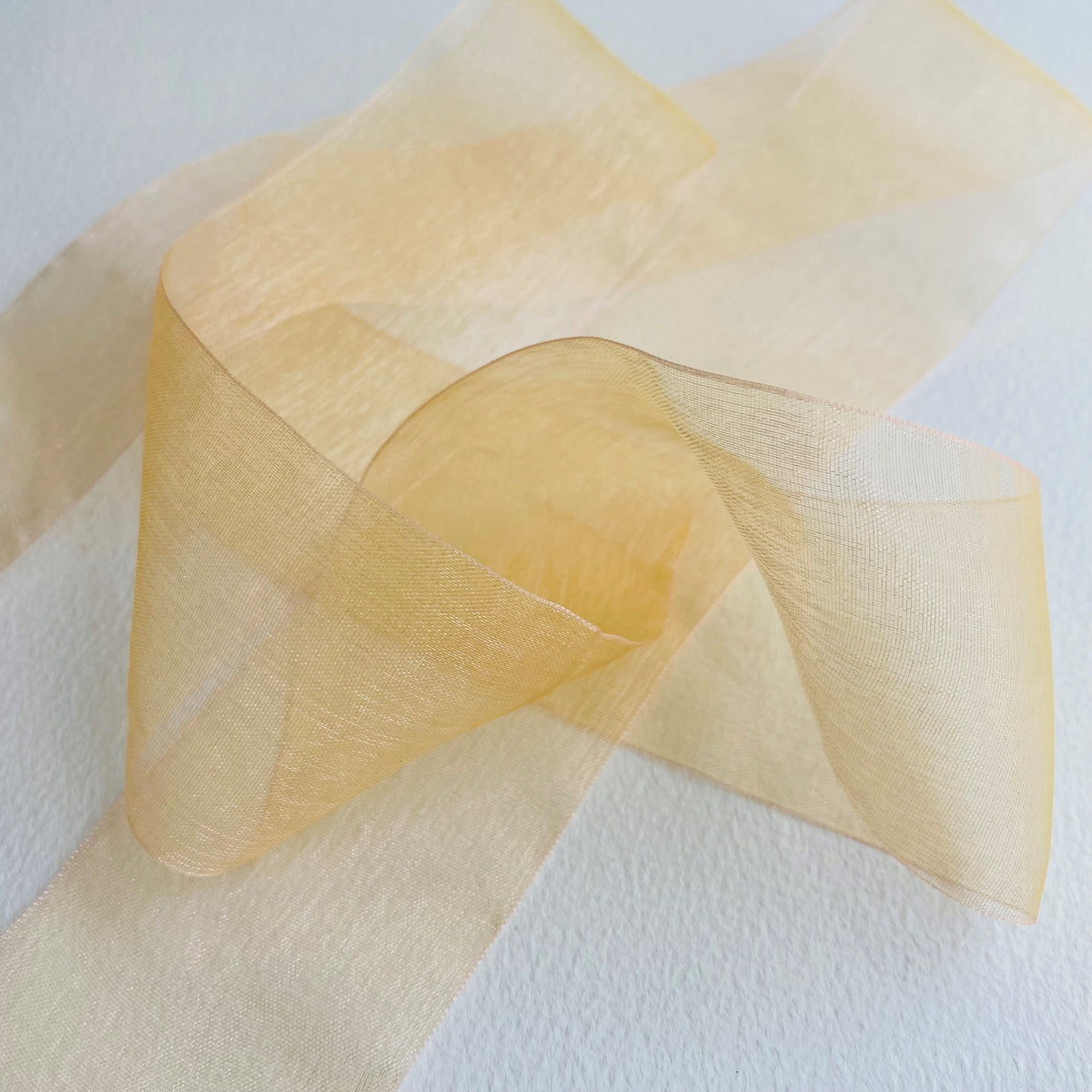 50mm Chiffon ribbon by MOKUBA A luxurious soft sheer chiffon ribbon trim by Mokuba, which comes in 6 beautiful colours.  Col: Gold 01, Blue 02, Navy 09, Grey 15, Blush 16, and Red 23.