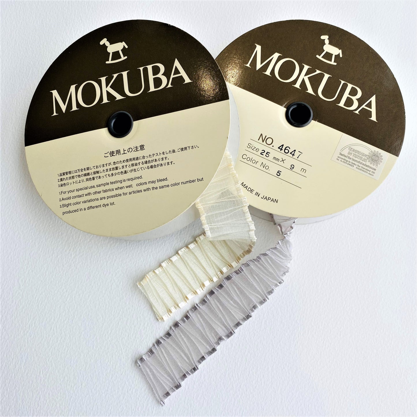 25mm Pleated Organza ribbon by MOKUBA A beautifully soft pleated Organza Sheer ribbon trim by Mokuba, carefully gathered, which comes in two delightful colours.  Col: Grey 05 and Gold 12