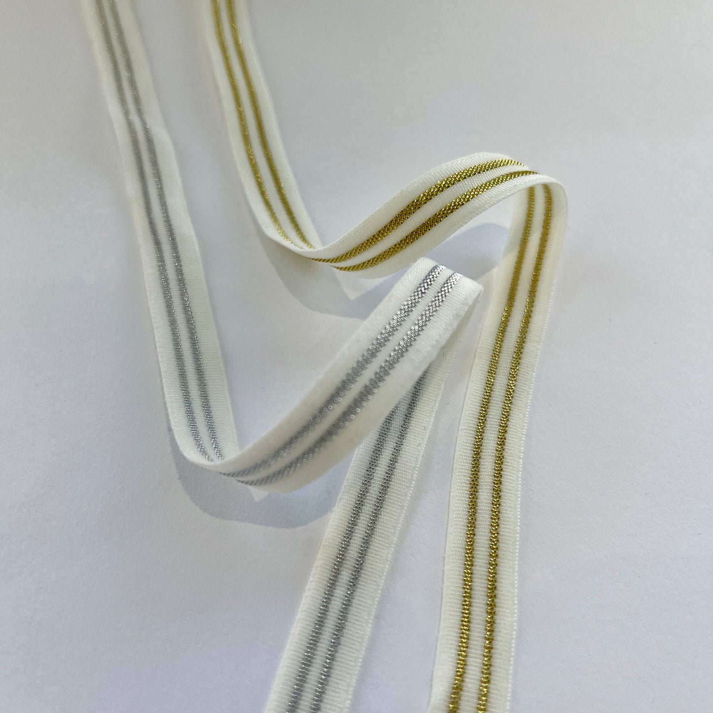 10mm Wide Sporty Stripe Lurex Elastics in ivory with gold stripe and white with silver stripe