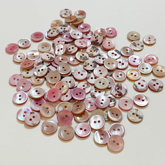 Set of 10 shirt buttons. Beautiful 2 hole Trocas shell shirt buttons in varying shades of pink.Deadstock shell buttons.