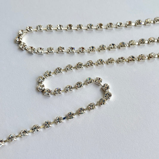 Sparkly rhinestone trim - premium high grade diamanté crystals set in a flexible metal chain casing. Popular for bridal wear, evening wear, crafts, jewellery and headband making.