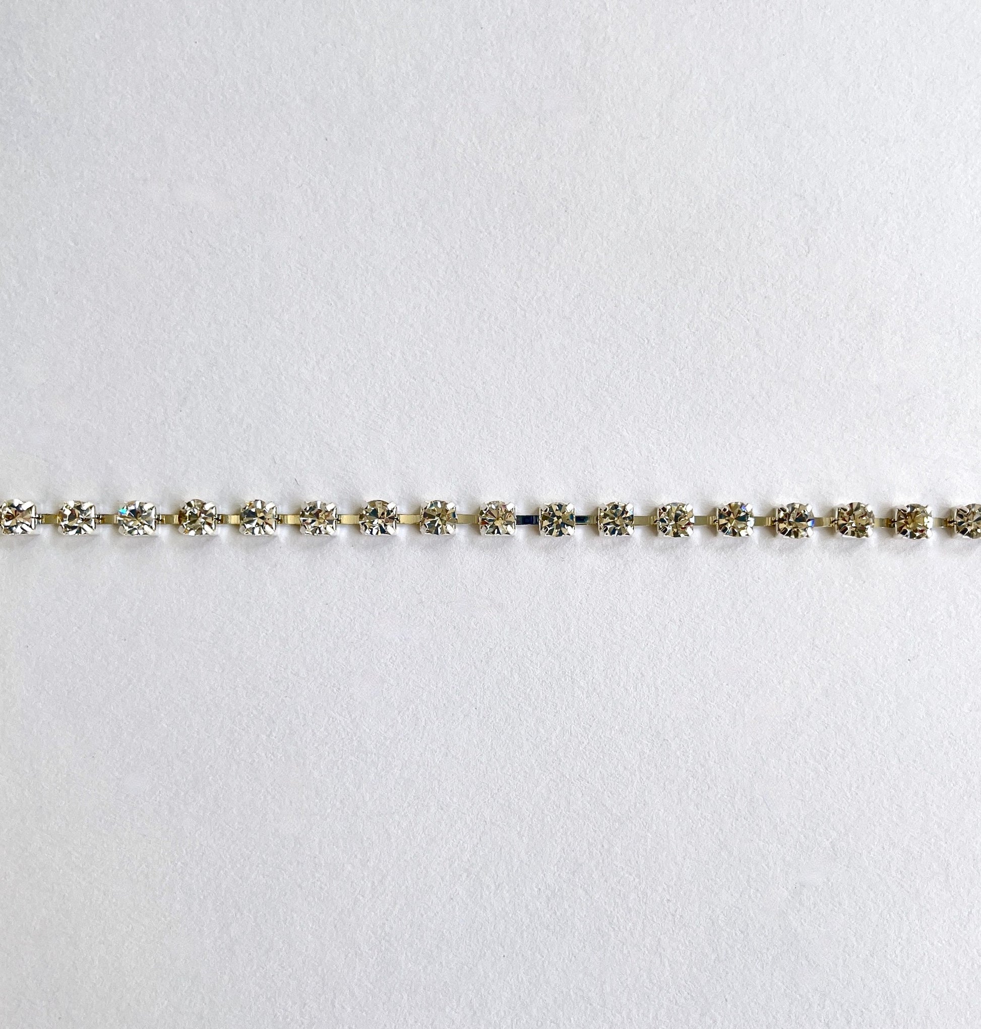 Sparkly rhinestone trim - premium high grade diamanté crystals set in a flexible metal chain casing. Popular for bridal wear, evening wear, crafts, jewellery and headband making.