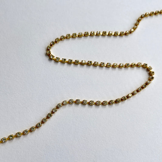 Narrow rhinestone trim - premium high grade diamanté crystals set in a flexible metal chain casing.