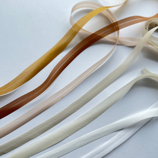 A beautiful silk organza, double folded, bias binding used to finish the edges of sheer and fine fabrics. Perfect for bridal wear, lingerie and bra making.