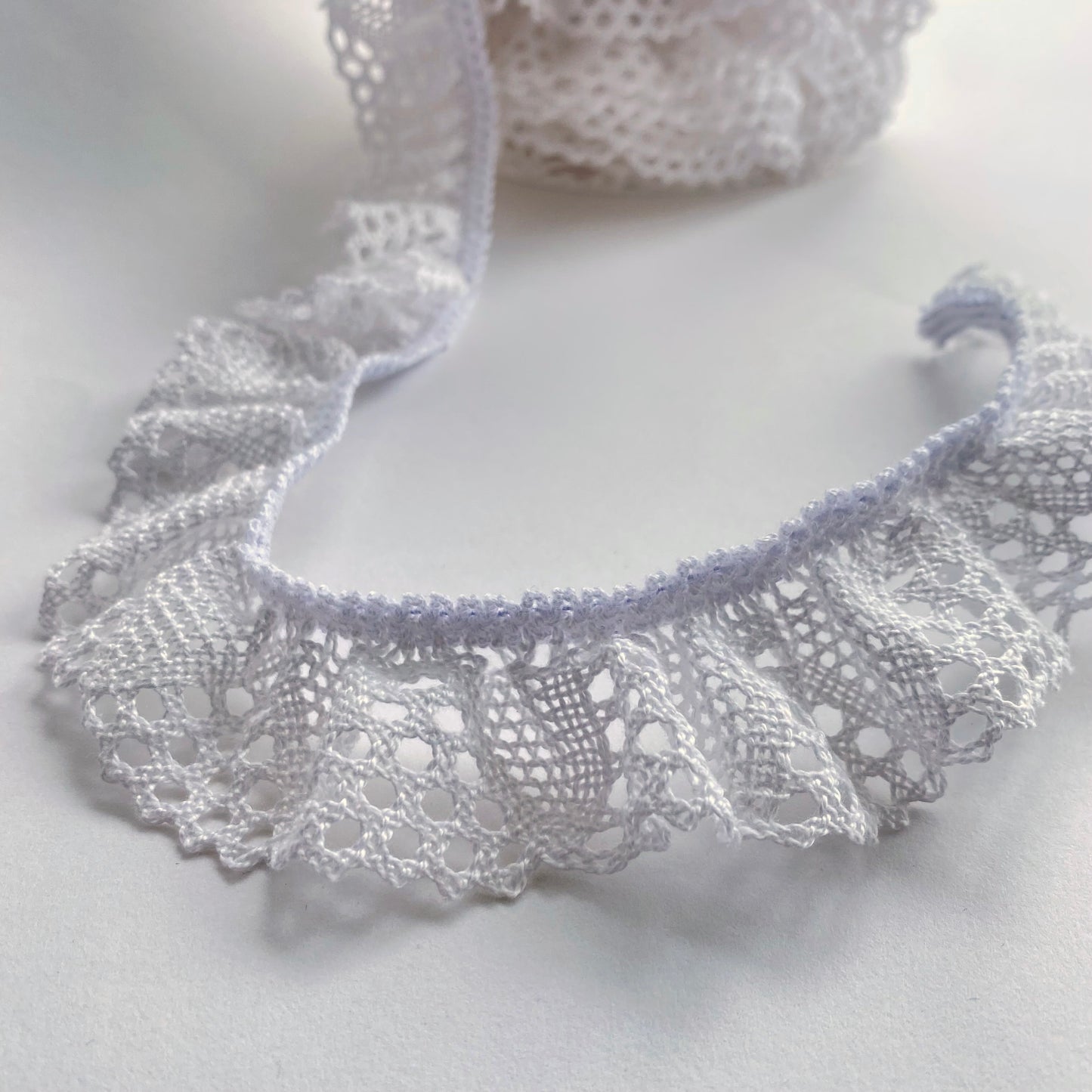 40mm wide Ruffled Cluny, macramé, crochet lace trim with a stretchy edge. This lace is eco friendly as the cotton is Oeko Tex 'Made in Green' standard.