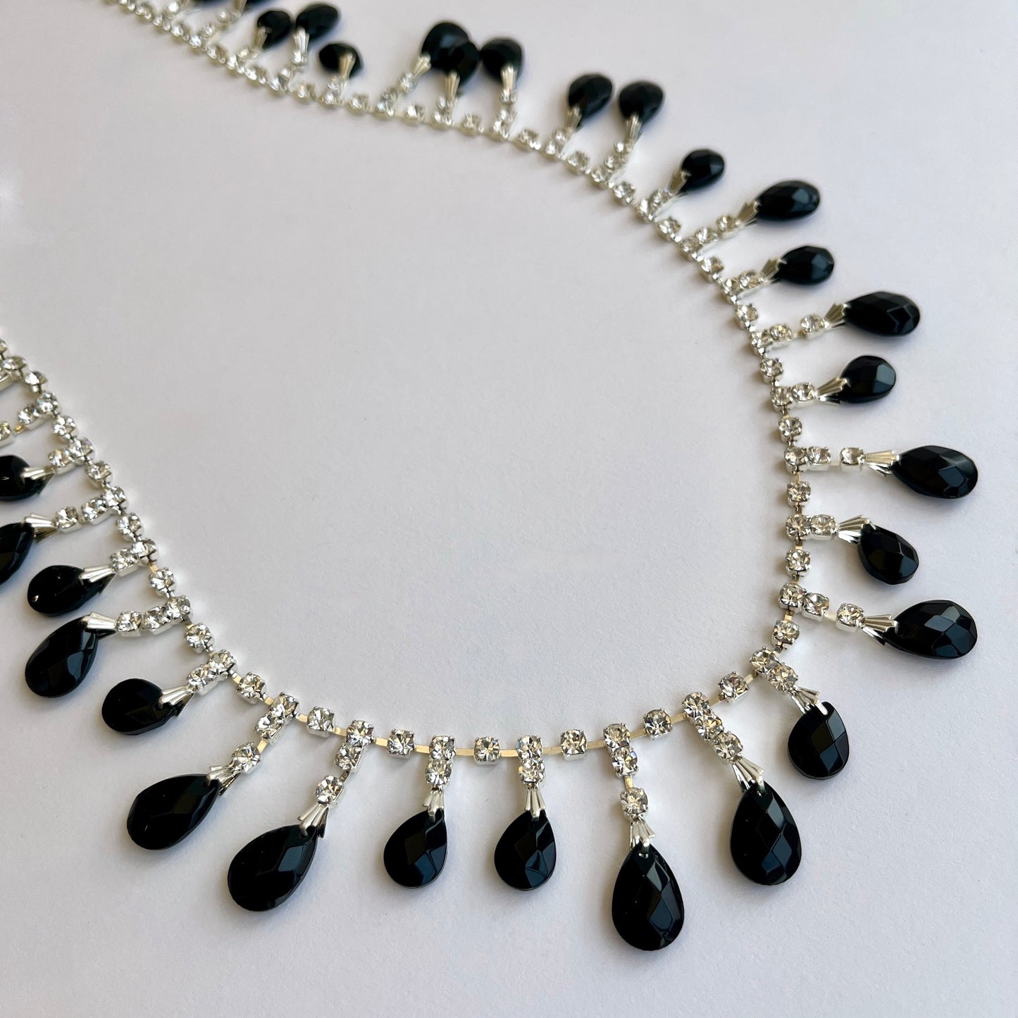 Fabulous rhinestone and faux jet beaded trim made premium high grade diamanté crystals set in a flexible metal chain casing.