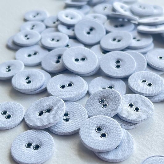 Lovely utilitarian, vintage style linen covered buttons. Flat with 2 holes and fabric on both sides of the button.   Price is for 10 buttons Colour: white Sizes: 26 Ligne (16mm), 28 Ligne (18mm), 30 Ligne (19mm)