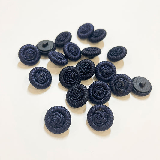 Vintage passementerie cord buttons, we believe to be from the 1980s. Would make a beautiful feature button on a cape, coat or jacket, and the perfect button for bridal wear or evening wear. Buttons backs are plastic with a loop shank.